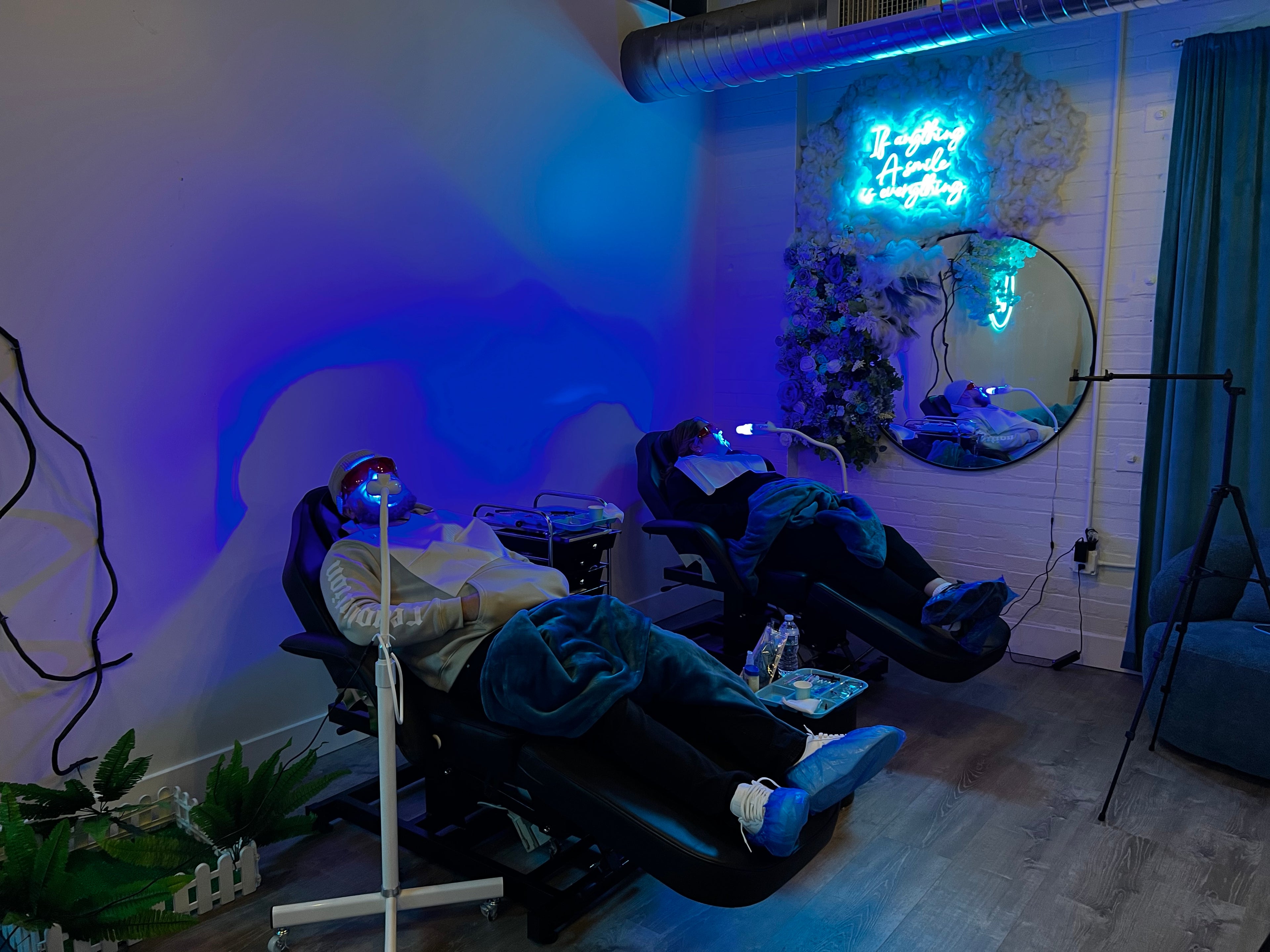 Couples teeth whitening session at Grin & Glow featuring a side-by-side treatment experience with visible results for both partners in one visit.