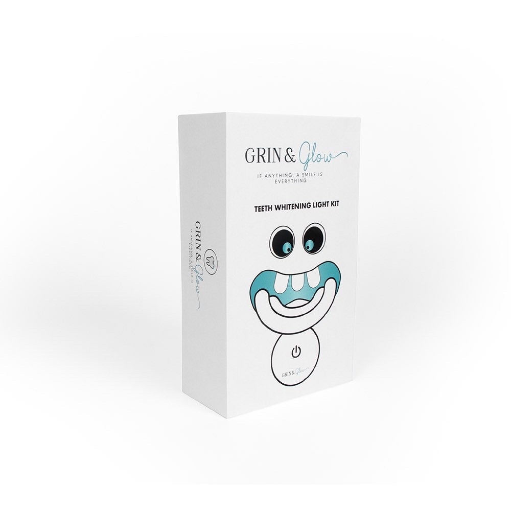 Grin & Glow Teeth Whitening Kit – vegan-friendly, non-invasive whitening system with LED light, whitening gel, and applicator for a brighter smile at home.