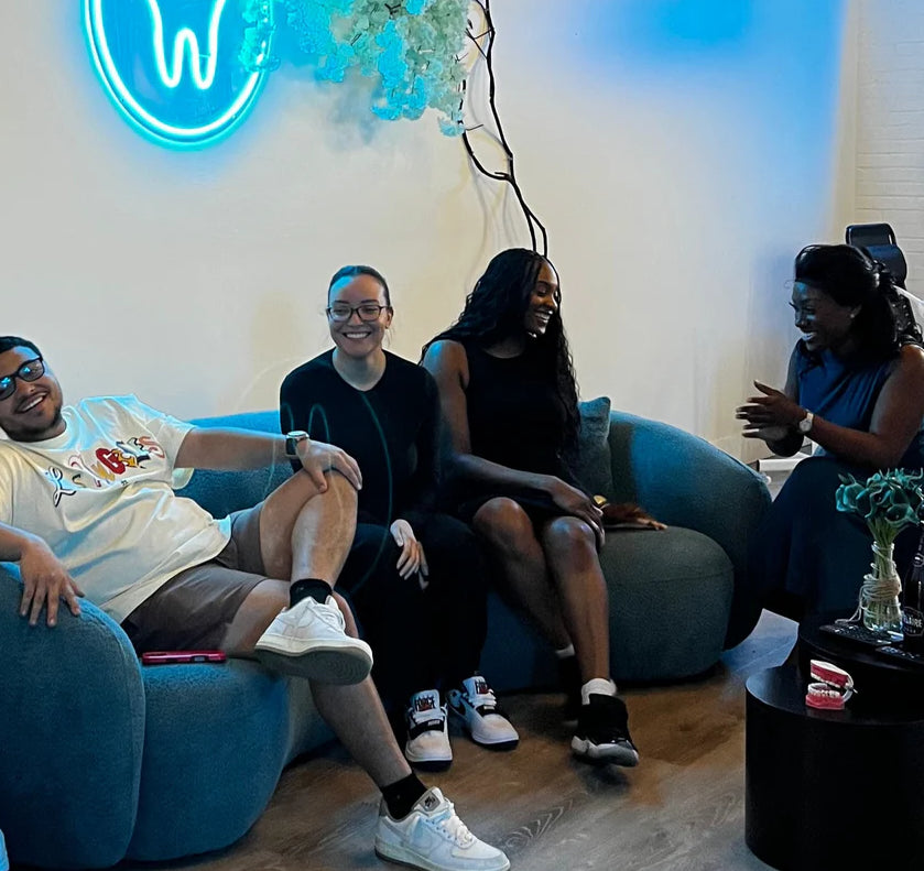 A client enjoying a relaxing, high-end whitening session at Grin & Glow luxury studio.